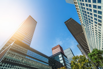 Obraz premium low angle view of skyscrapers in city of China against blue sky