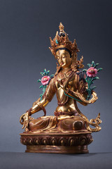 Bronze figurine of a green Tara full of wisdom.