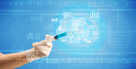 Female doctor holding syringe