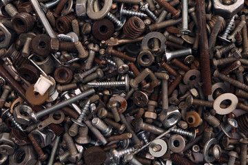 Abstract grunge metallic background. Old rusty screw. Building waste.