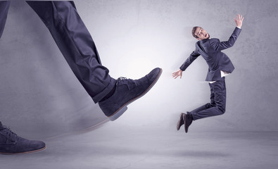 Foot kicking, businessman flying