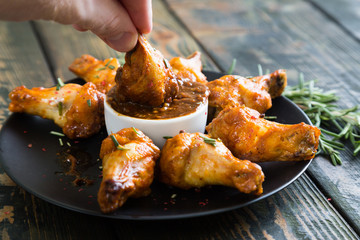 Fried chicken wings with spicy sauce