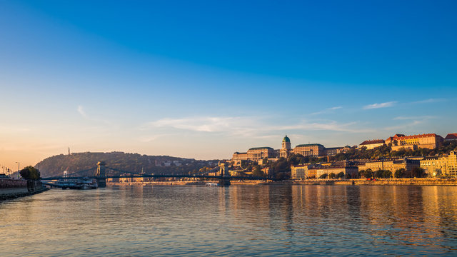 Budapest, Hungary - Golden surise over the River Danube with Szechenyi Chain Bridge, Buda Castle Royal Palace, Gellert Hill and Statue of Liberty at background