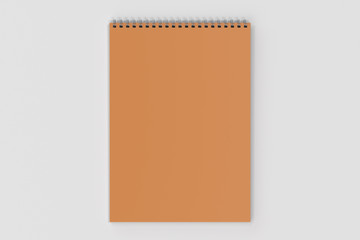 Blank orange notebook with metal spiral bound on white background