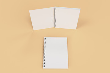 Two notebooks with spiral bound on orange background