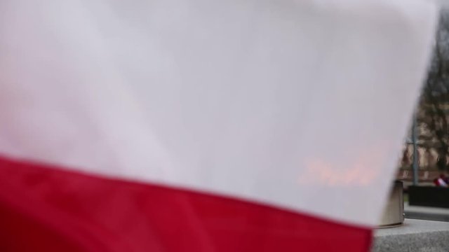 Znicz and the flag of the Polish state.
