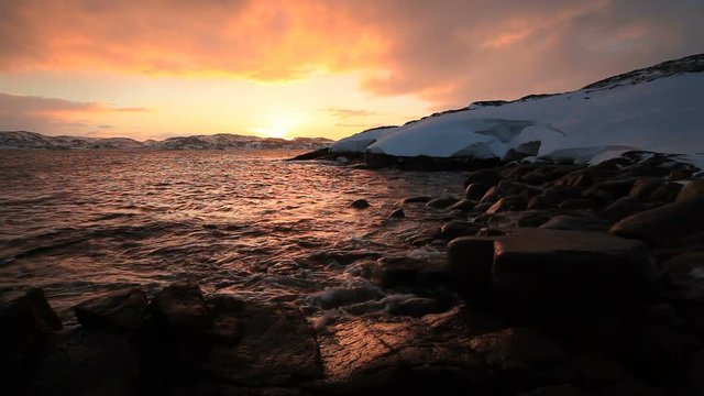 Arctic Ocean at sunset during a storm
