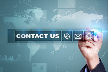 Contact us button and text on virtual screen. Business and technology concept.
