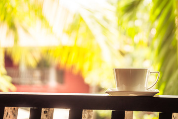 White coffee cup around outdoor patio