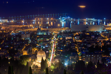 The golden dome of the Bahai Temple in Haifa illuminated by night lights. Israel.