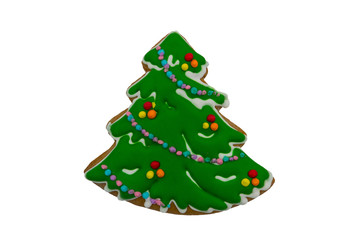 Christmas gingerbread cookie made in shape of Christmas tree isolated on white background