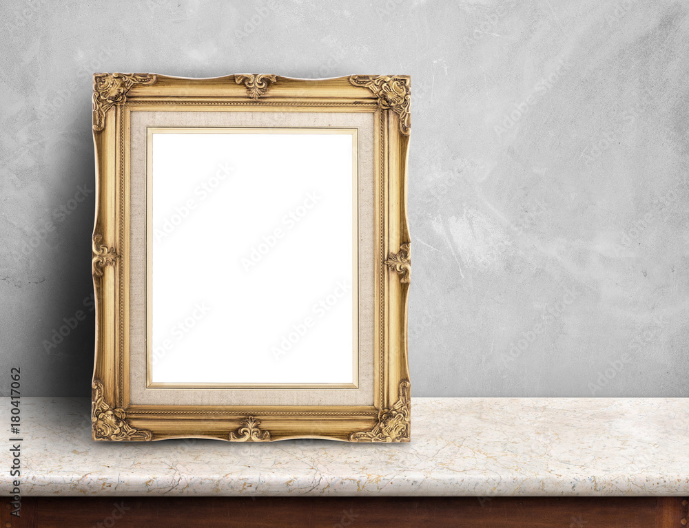 Leinwandbilder Blank Gold victorian picture frame on white marble table at grey concrete wall,Template mock up for adding your design and leave space beside frame for adding more text.
