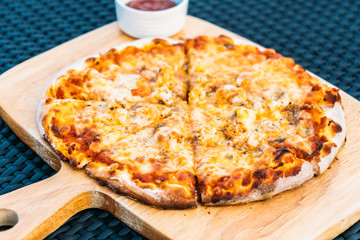 Seafood pizza on wood tray