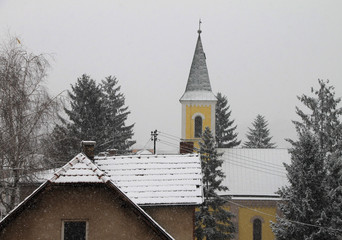 Fototapeta na wymiar Detail of yellow church in small town in Bosnia and Herzegovina