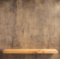 wooden shelf at concrete wall