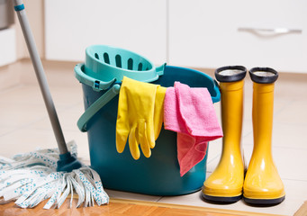 Cleaning equipment on kitchen floor