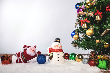 Christmas decoration Holiday or new year with Santa Claus and snowman on snow background and copy space