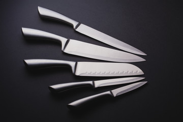 steel kitchen knives on the black