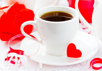 White cup of black coffee with little red heart. Valentine Day Concept