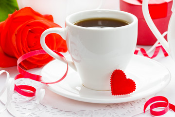 White cup of black coffee with little red heart. Valentine Day Concept