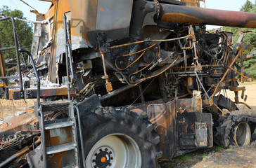 Fototapeta premium Combine harvester destroyed by fire