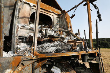 Combine harvester destroyed by fire