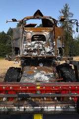 Fototapeta premium Combine harvester destroyed by fire