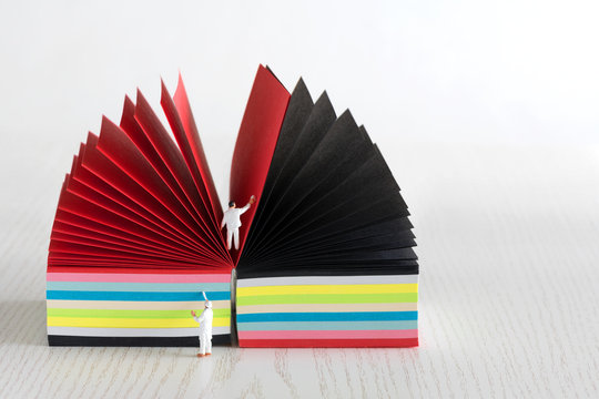 Bring colour into your life - notepad with colourful sheeds and two painters - miniature figures