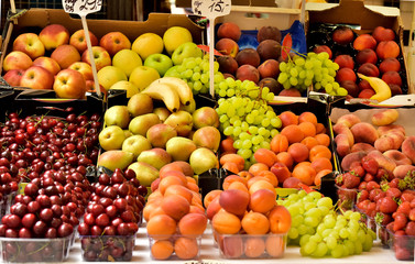 Food market.Sale of fruit in the market.Good harvest.Large range of fruits.Consumer basket.