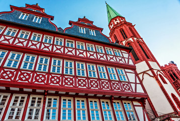 Obraz premium The old historic half-timbered houses in the midst of the banking city Frankfurt am Main, Germany