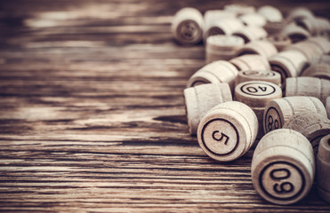 Frame of lotto's wooden barrel on the table. close up. Toned image.