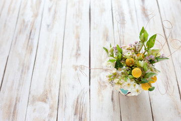 Bouquet of flowers on a old wooden background