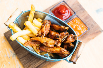 Fried chicken wing with french fries