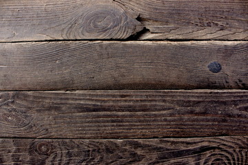 Aged dark brown wooden boards (planks) as grunge wooden background. Aged tree boards. 