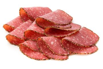 Salami slices isolated on the white background.