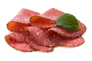 Salami slices isolated on the white background.