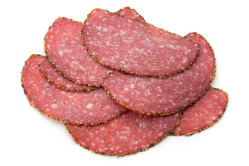 Salami slices isolated on the white background.