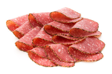 Salami slices isolated on the white background.
