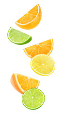 Isolated falling citrus pieces. Slices of orange, lemon and lime floating in the air isolated on...