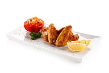 Grilled chicken wings and vegetables