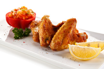 Grilled chicken wings and vegetables