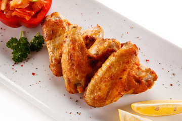 Grilled chicken wings and vegetables