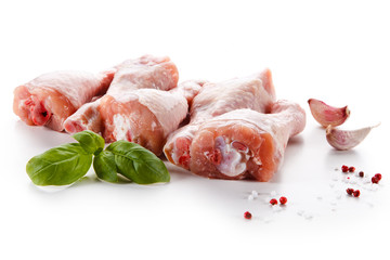 Raw chicken legs on white background