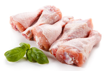 Raw chicken legs on white background