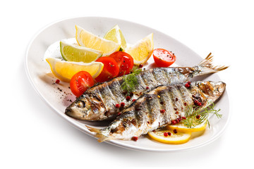 Fish dish - grilled herrings with vegetables