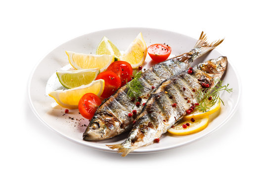Fish dish - grilled herrings with vegetables