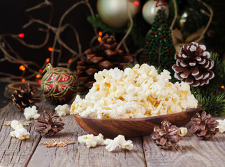 popcorn on the background of Christmas and New Year's decorations, selective focus