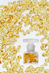 Vintage bottle and yellow amber stones.