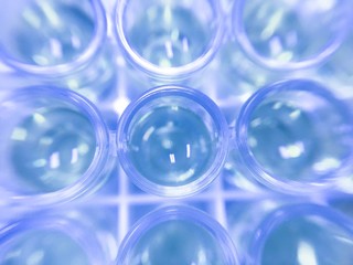 Blurred background -blue solution in glass tube in laboratory