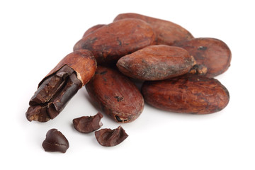 unpeeled cocoa bean isolated on white background macro top view